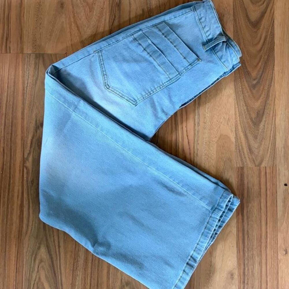 Light blue denim patch pocket pants with a relaxed fit, wide leg, size L